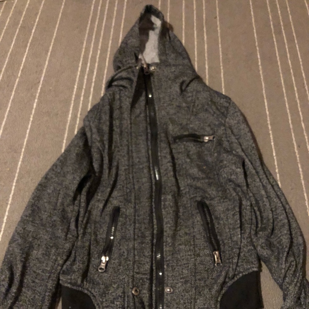 Black  jacket plus a white long sleeve cardigan